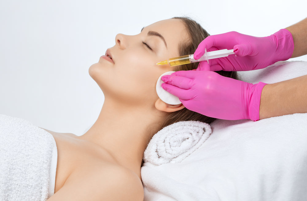 Woman receiving PRP facial treatment with platelet-rich plasma at Elite Med Spa