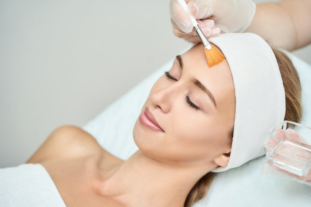 Woman relaxing during chemical peel treatment at Elite Med Spa