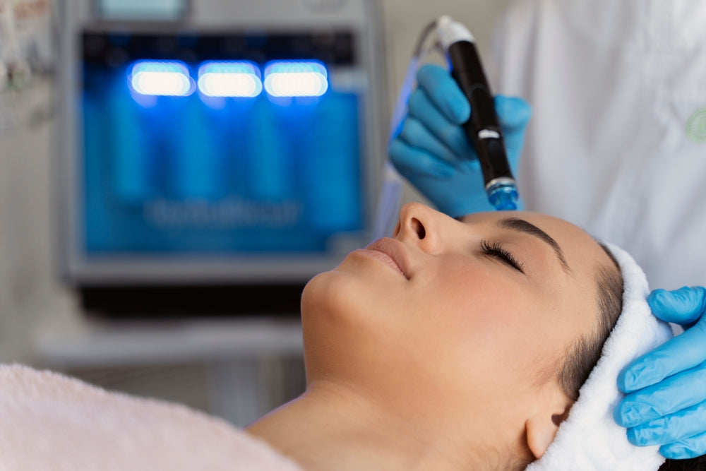 Woman receiving HydraFacial skin treatment at Elite Med Spa