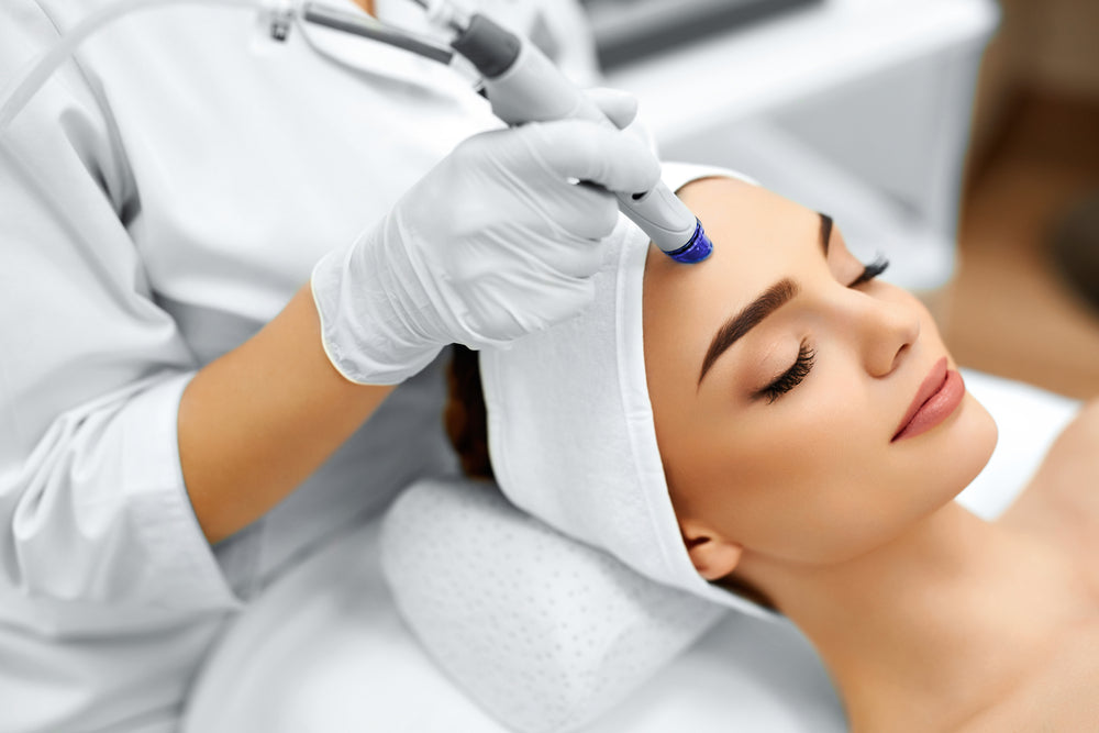 Woman receiving facial rejuvenation treatment at Elite Med Spa