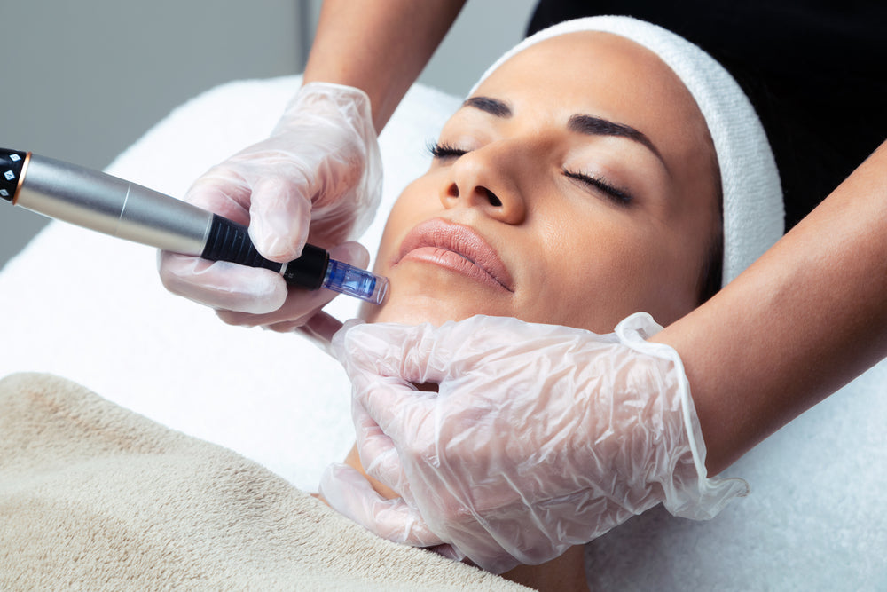Client receiving microneedling facial treatment at Elite Med Spa