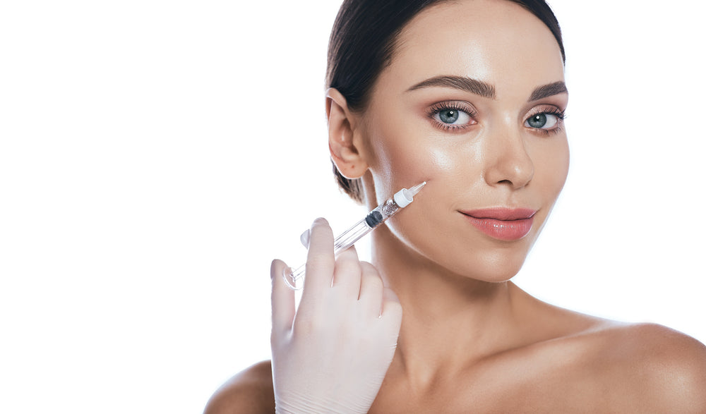 Woman receiving dermal filler injection at Elite Med Spa