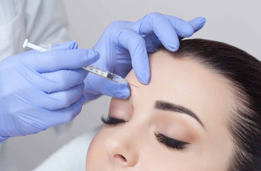 Woman receiving forehead Botox injection at Elite Med Spa